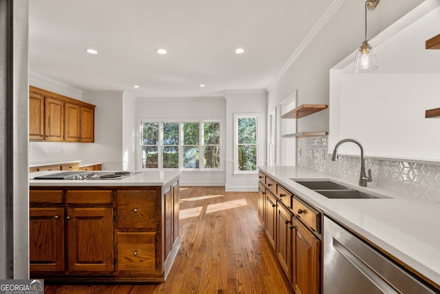 kitchen featuring tasteful backsplash, a sink, light countertops, appliances with stainless steel finishes, and open shelves