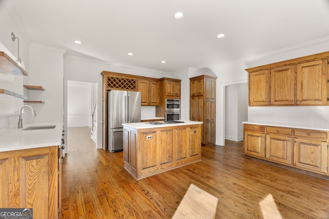 kitchen with open shelves, light wood-style flooring, ornamental molding, a sink, and appliances with stainless steel finishes