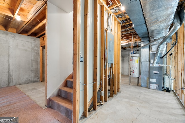 unfinished basement featuring water heater, heating unit, stairs, and electric panel