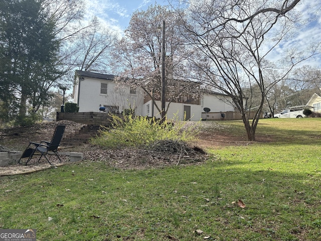 view of home's exterior with a yard