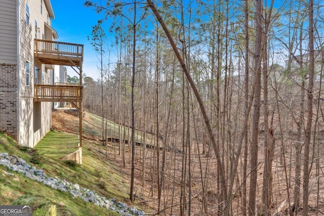 view of yard featuring a wooden deck