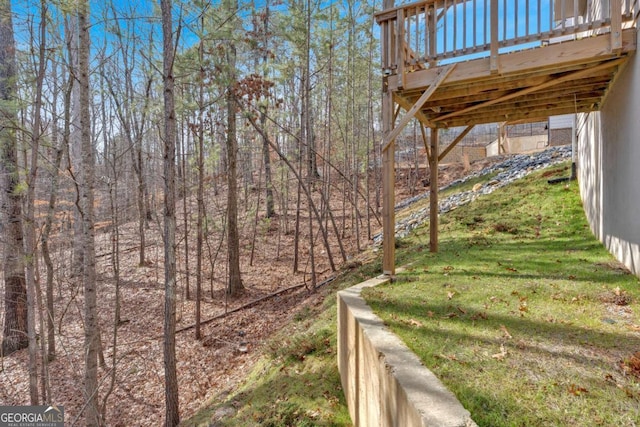 view of yard with a wooden deck