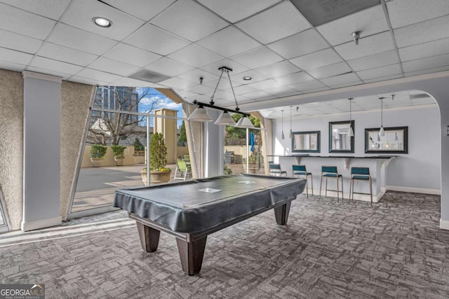 rec room with baseboards, arched walkways, carpet, pool table, and a paneled ceiling