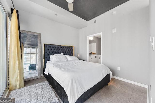 250 Pharr Rd Unit 1702, Atlanta, GA 30305 - bedroom featuring ensuite bathroom, ceiling fan, and tile patterned floors
