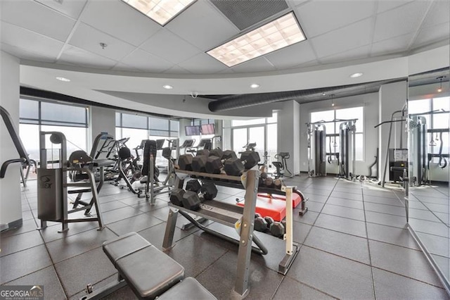250 Pharr Rd Unit 1702, Atlanta, GA 30305 - exercise room with healthy amount of natural light and a drop ceiling