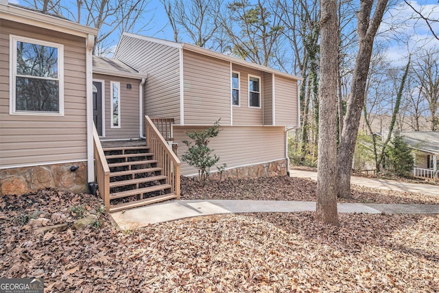 view of front of home featuring stairway