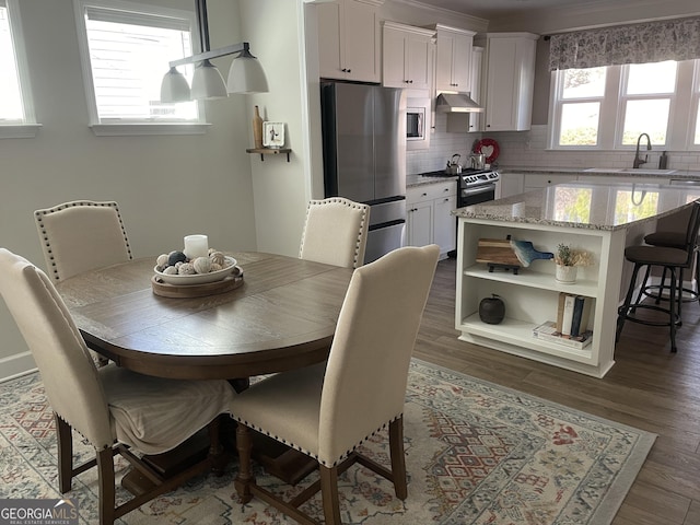 dining space featuring dark wood finished floors