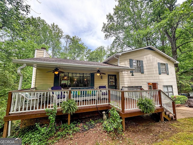 1972 Cox Dr, Austell, GA 30168 - view of front of property with a ceiling fan, a wooden deck, and a chimney