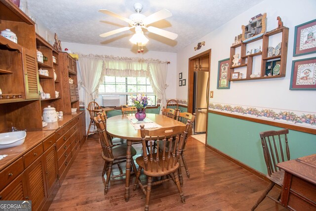 1972 Cox Dr, Austell, GA 30168 - dining area featuring a ceiling fan, a textured ceiling, and wood finished floors