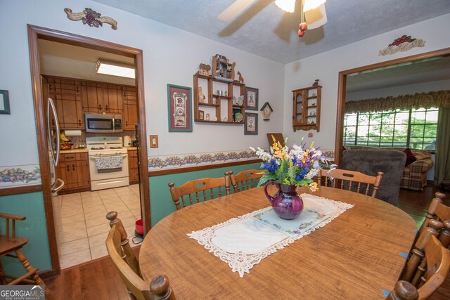 1972 Cox Dr, Austell, GA 30168 - dining room with light wood-style flooring and ceiling fan