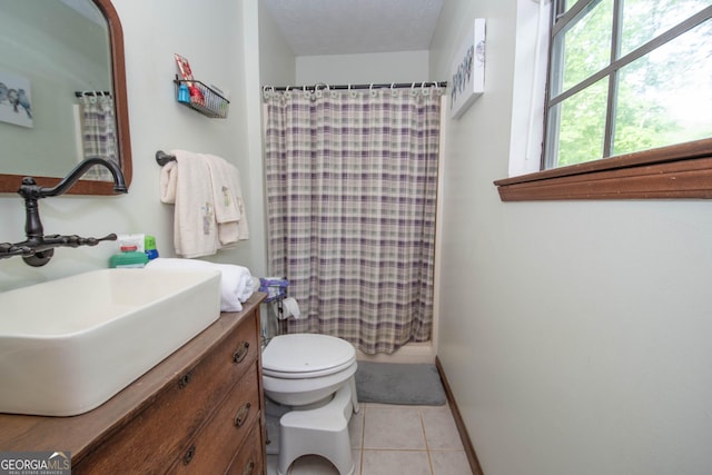 1972 Cox Dr, Austell, GA 30168 - bathroom with vanity, curtained shower, toilet, baseboards, and tile patterned floors