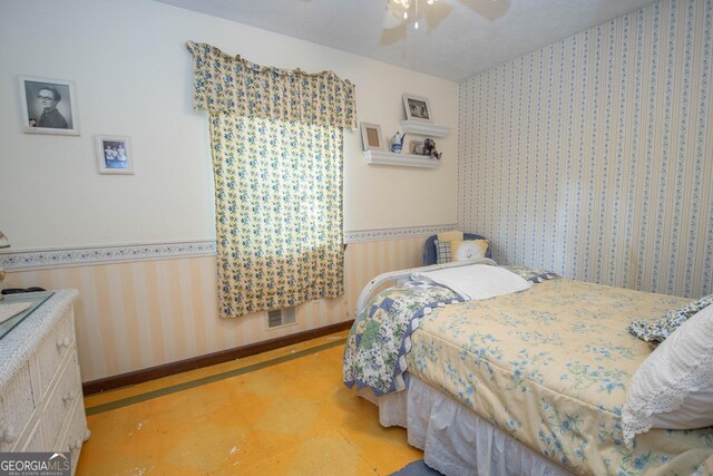 1972 Cox Dr, Austell, GA 30168 - bedroom with baseboards, a ceiling fan, wallpapered walls, and visible vents