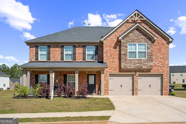 197 Stocks Cir, West Point, GA 31833 - craftsman inspired home with concrete driveway, a front lawn, an attached garage, a porch, and brick siding