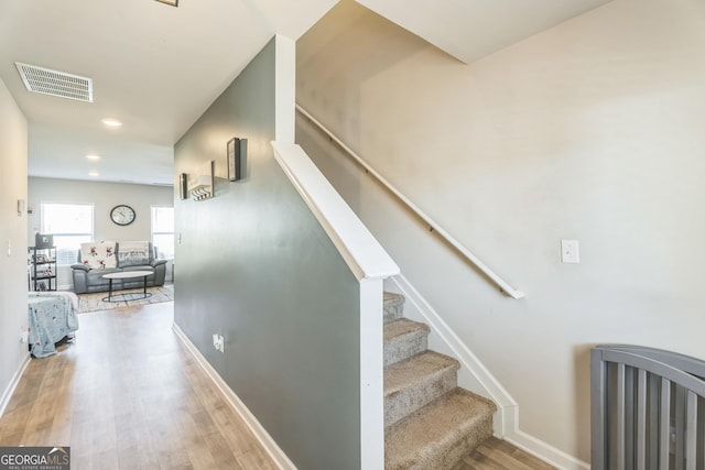 197 Stocks Cir, West Point, GA 31833 - stairs with baseboards, wood finished floors, visible vents, and recessed lighting