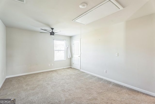 197 Stocks Cir, West Point, GA 31833 - spare room featuring attic access, carpet floors, baseboards, and ceiling fan