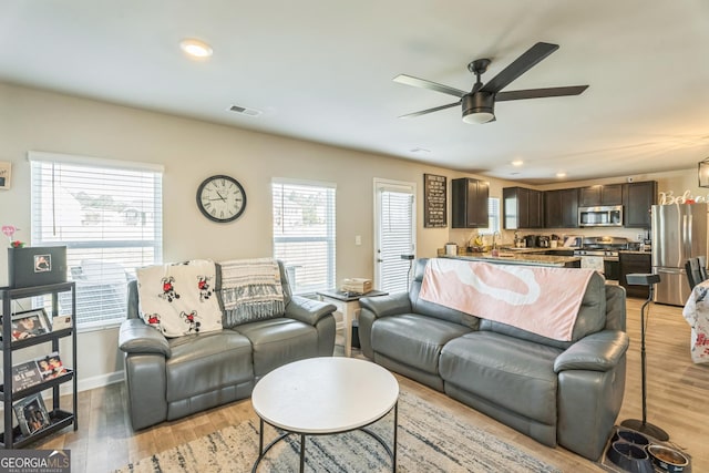 197 Stocks Cir, West Point, GA 31833 - living room featuring a ceiling fan, light wood-style flooring, baseboards, visible vents, and recessed lighting