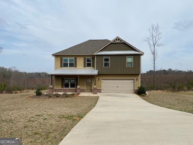 craftsman house with driveway and an attached garage