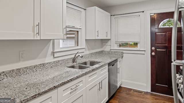 1132 Fair St SW, Atlanta, GA 30314 - kitchen featuring a sink, stainless steel dishwasher, white cabinets, dark wood finished floors, and light stone counters