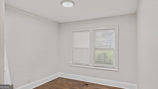 1132 Fair St SW, Atlanta, GA 30314 - unfurnished room with ornamental molding, baseboards, and dark wood-type flooring