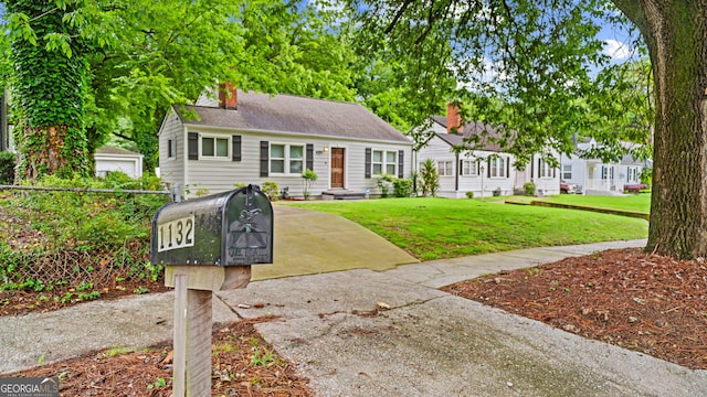 1132 Fair St SW, Atlanta, GA 30314 - view of front of home with a front yard and a chimney