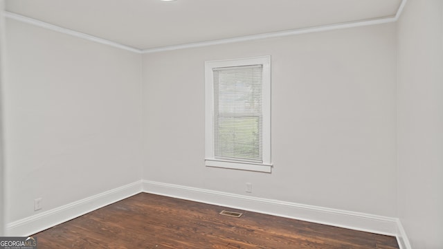 1132 Fair St SW, Atlanta, GA 30314 - spare room featuring ornamental molding, baseboards, and dark wood finished floors