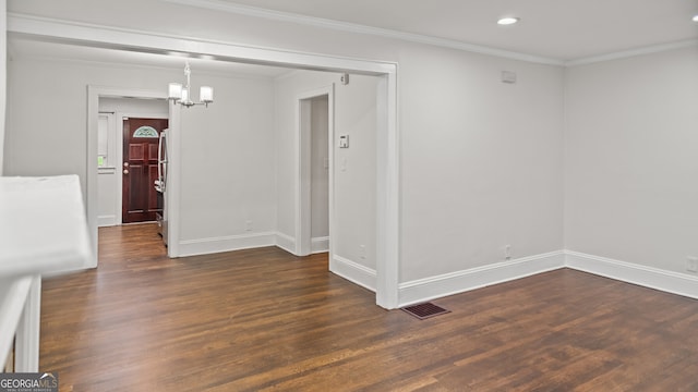 1132 Fair St SW, Atlanta, GA 30314 - empty room with wood finished floors, ornamental molding, recessed lighting, baseboards, and a chandelier