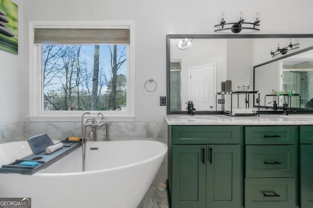 full bathroom featuring a sink, a soaking tub, a stall shower, and double vanity