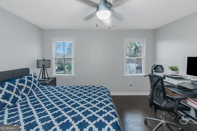 bedroom with baseboards, multiple windows, and a ceiling fan