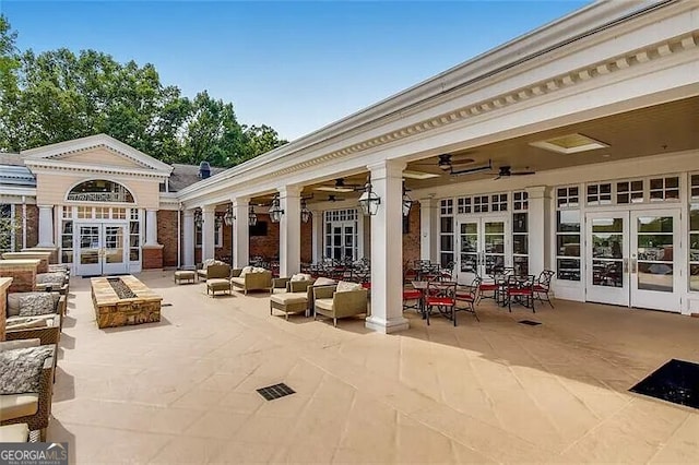 view of patio / terrace featuring french doors and ceiling fan