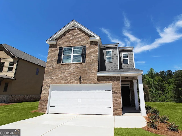 view of front of home featuring brick siding, a garage, a front yard, and driveway