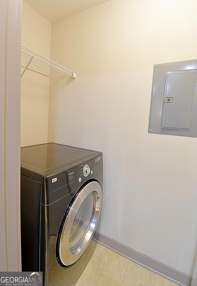 laundry room with electric panel, laundry area, washer / clothes dryer, and baseboards