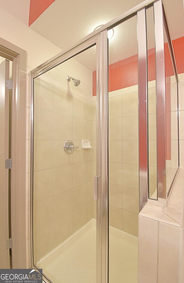 full bathroom with a stall shower