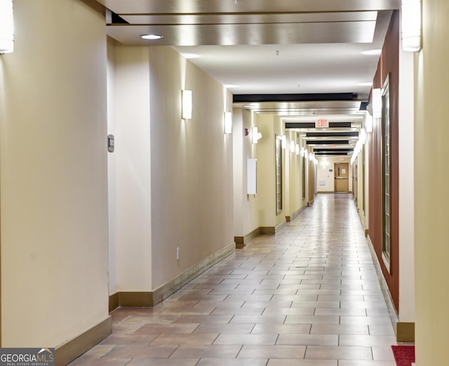 corridor featuring baseboards