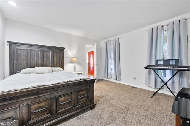 bedroom with baseboards, multiple windows, and carpet flooring