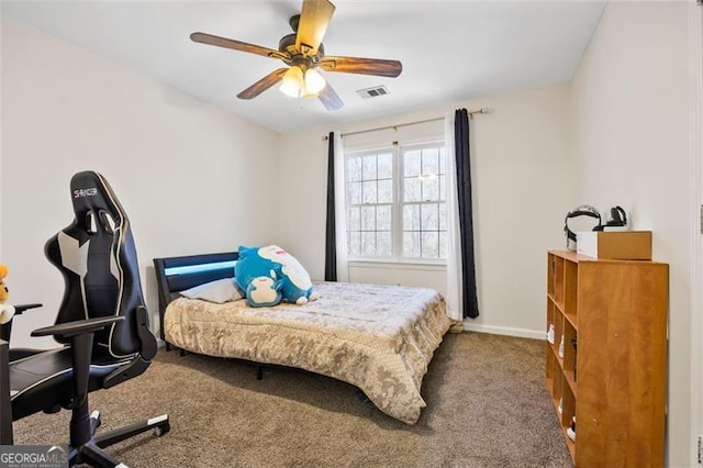 carpeted bedroom featuring visible vents, ceiling fan, and baseboards