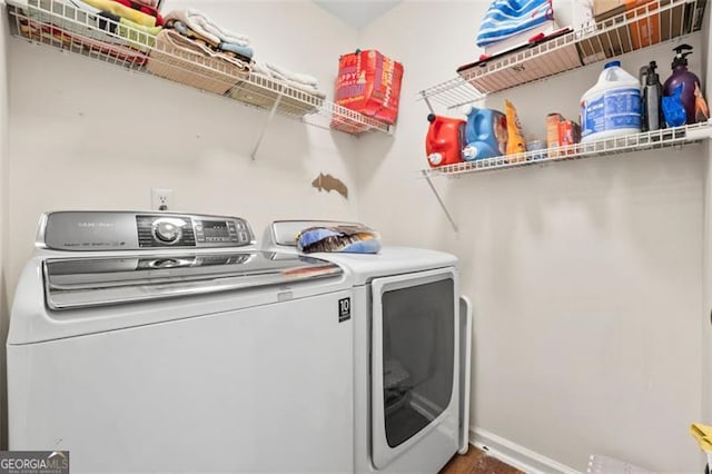 laundry area featuring washer and clothes dryer and laundry area