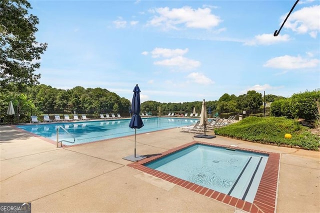 community pool with a patio area