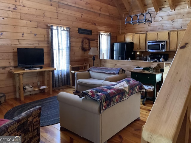 114 Palisade Dr, Ellijay, GA 30540 - living room featuring beamed ceiling, high vaulted ceiling, wood walls, and hardwood / wood-style floors
