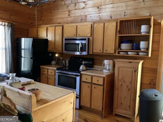 114 Palisade Dr, Ellijay, GA 30540 - kitchen with light countertops, stainless steel appliances, wooden walls, and plenty of natural light