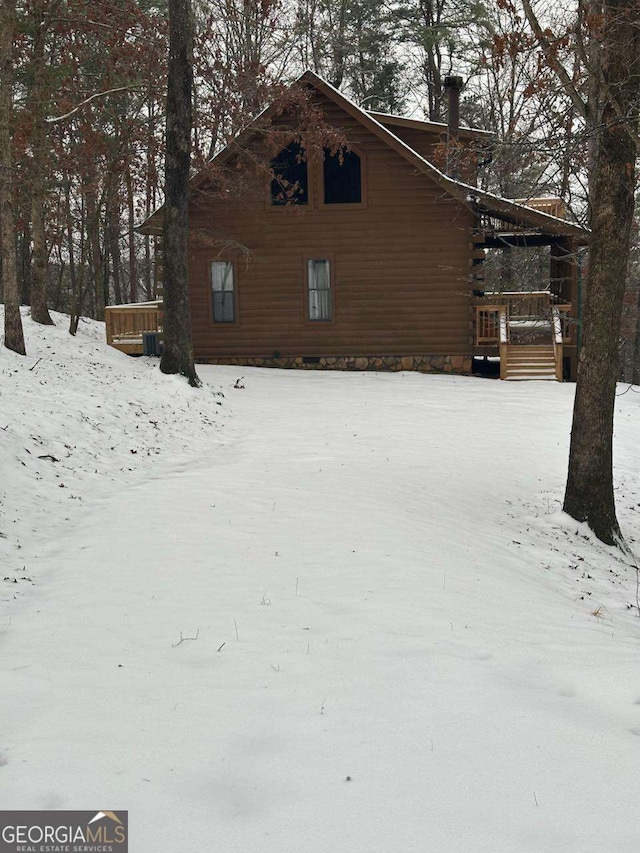 114 Palisade Dr, Ellijay, GA 30540 - view of snow covered exterior featuring a deck and log exterior
