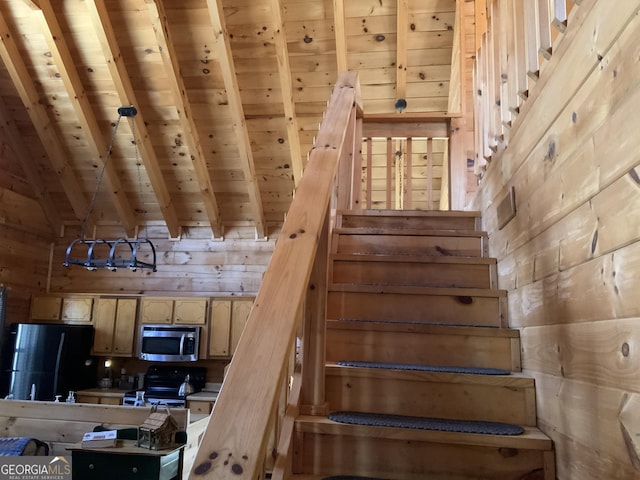 114 Palisade Dr, Ellijay, GA 30540 - stairway with vaulted ceiling with beams, wooden walls, and wooden ceiling