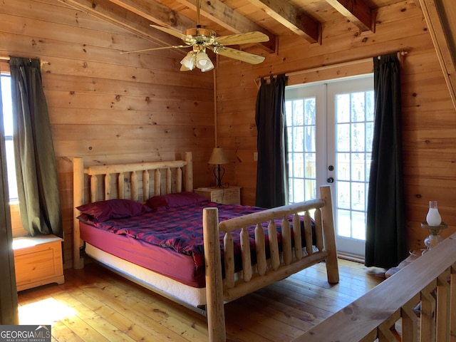 114 Palisade Dr, Ellijay, GA 30540 - bedroom featuring light wood-style floors, wood walls, beamed ceiling, and access to exterior