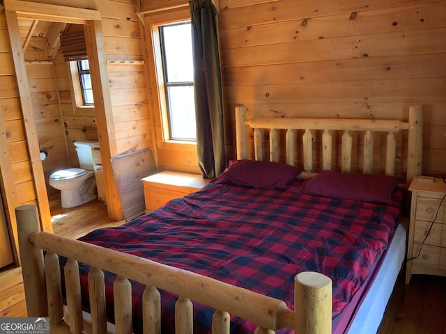 114 Palisade Dr, Ellijay, GA 30540 - bedroom with wooden walls and wood-type flooring