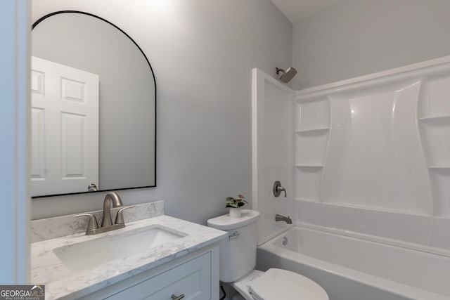 bathroom with vanity, toilet, and bathtub / shower combination