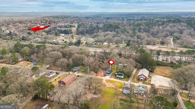 birds eye view of property with a wooded view