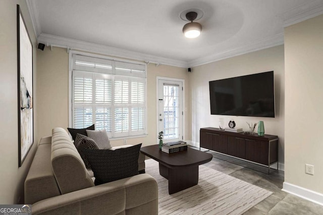 living room featuring baseboards and ornamental molding