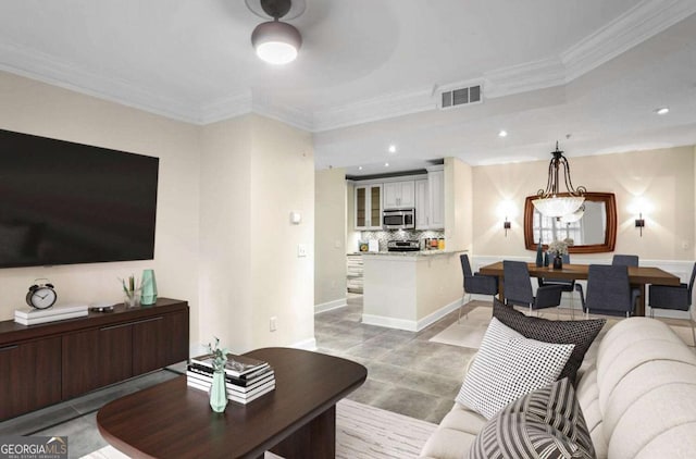 living room featuring visible vents, recessed lighting, and crown molding