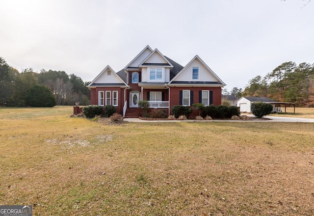 craftsman inspired home featuring brick siding, a porch, and a front lawn