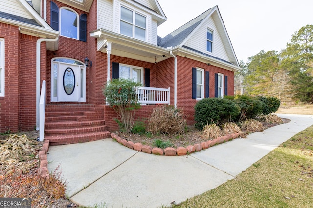 view of front of home featuring brick siding