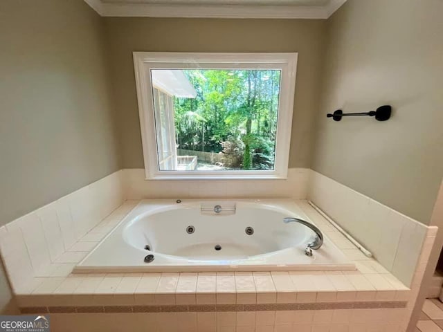 full bathroom featuring crown molding and a whirlpool tub
